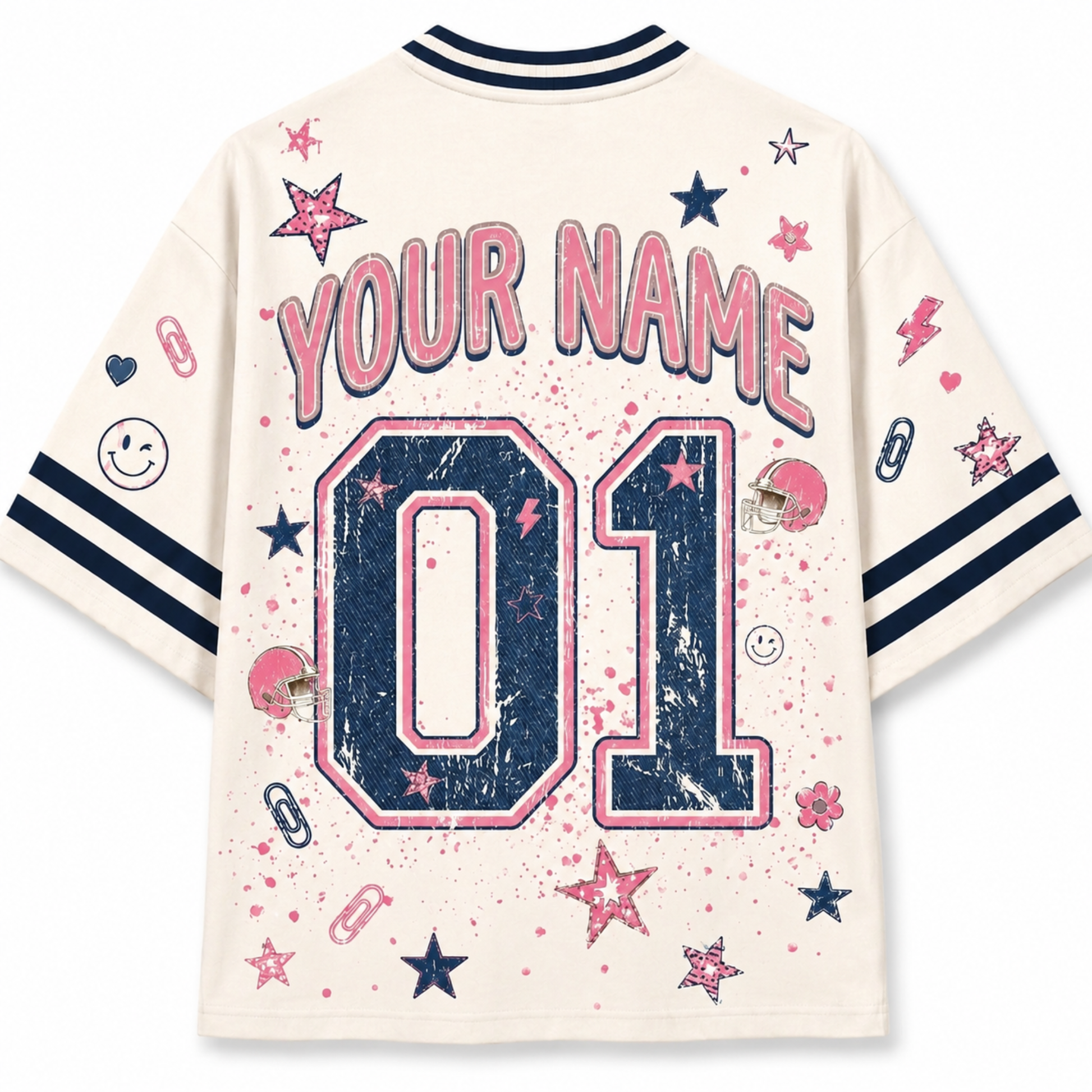 A cream-colored short-sleeve t-shirt with navy and pink athletic-style graphics, featuring 'YOUR NAME' and '01' on the back, along with stars, smiley faces, and small sports icons.