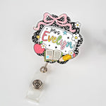 Decorative badge holder with 'Mrs. Evelyn' text on a white background