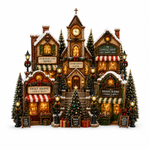 A detailed Christmas village diorama featuring a central church with a clock tower, surrounded by decorated storefronts including a candle shop, sweet shop, and holiday blooms, with lit Christmas trees and gift boxes on a white background.