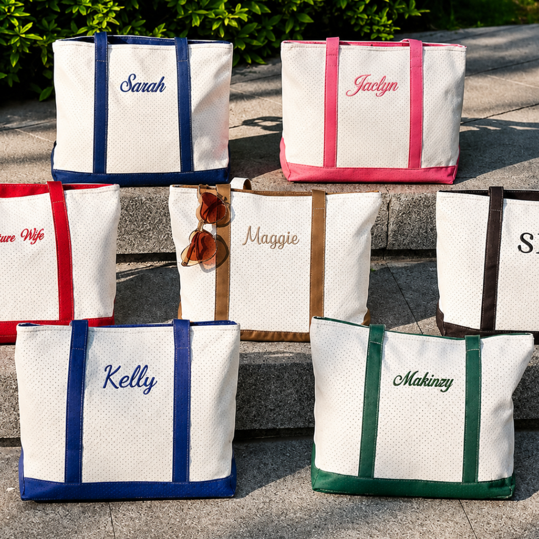Set of personalized tote bags with names on a stone surface