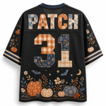 A black mesh short-sleeve jersey shown from the back, featuring the name 'PATCH' and number '31' in a patchwork autumn pattern. The bottom is decorated with a patchwork pumpkin and floral design, and the sleeves have matching patterned details.