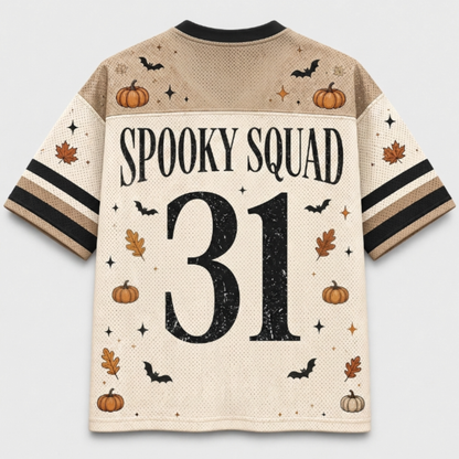 A short-sleeve sports jersey shown from the back, featuring a beige and cream mesh pattern with a black collar and sleeve stripes. The back is decorated with a Halloween theme, including the text 'SPOOKY SQUAD', the number '31' in distressed black, and illustrations of pumpkins, bats, leaves, and stars.