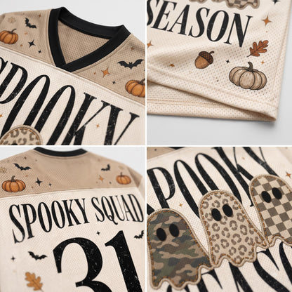 A four-panel close-up collage of a cream-colored hockey-style jersey with Halloween graphics. The jersey features black 'SPOOKY SQUAD' lettering, the number '31', pumpkins, bats, acorns, and ghost patches in camouflage, leopard print, and checkerboard patterns.