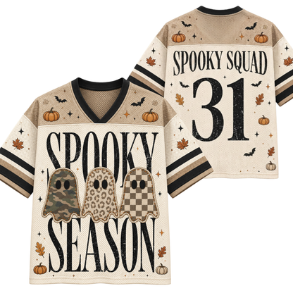 A front and back view of a beige mesh football-style jersey with Halloween graphics. The front features 'SPOOKY SEASON' in large black letters, three ghost illustrations in camouflage, leopard print, and checkerboard patterns, and small pumpkins, bats, and leaves.